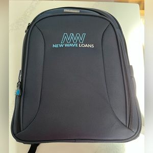 NWOT blue samsonite xenon 3.0 checkpoint friendly backpack. New wave loans logo.
